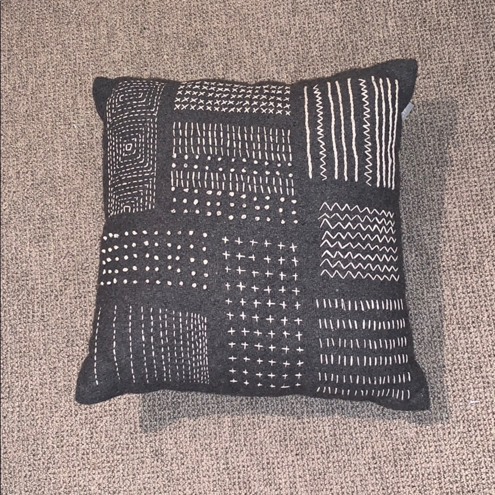 Gray Throw Pillow with White Embroidery